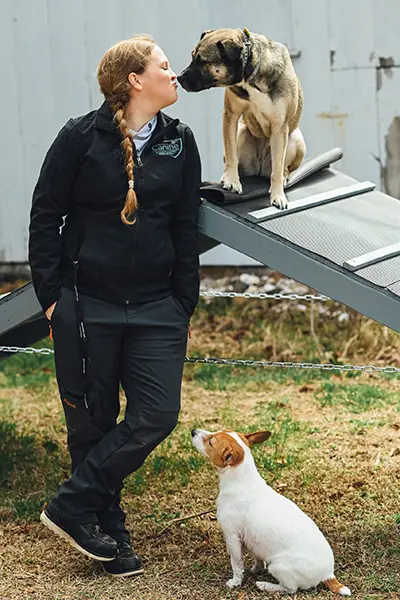 Dog trainer Rebecca May with puppies
